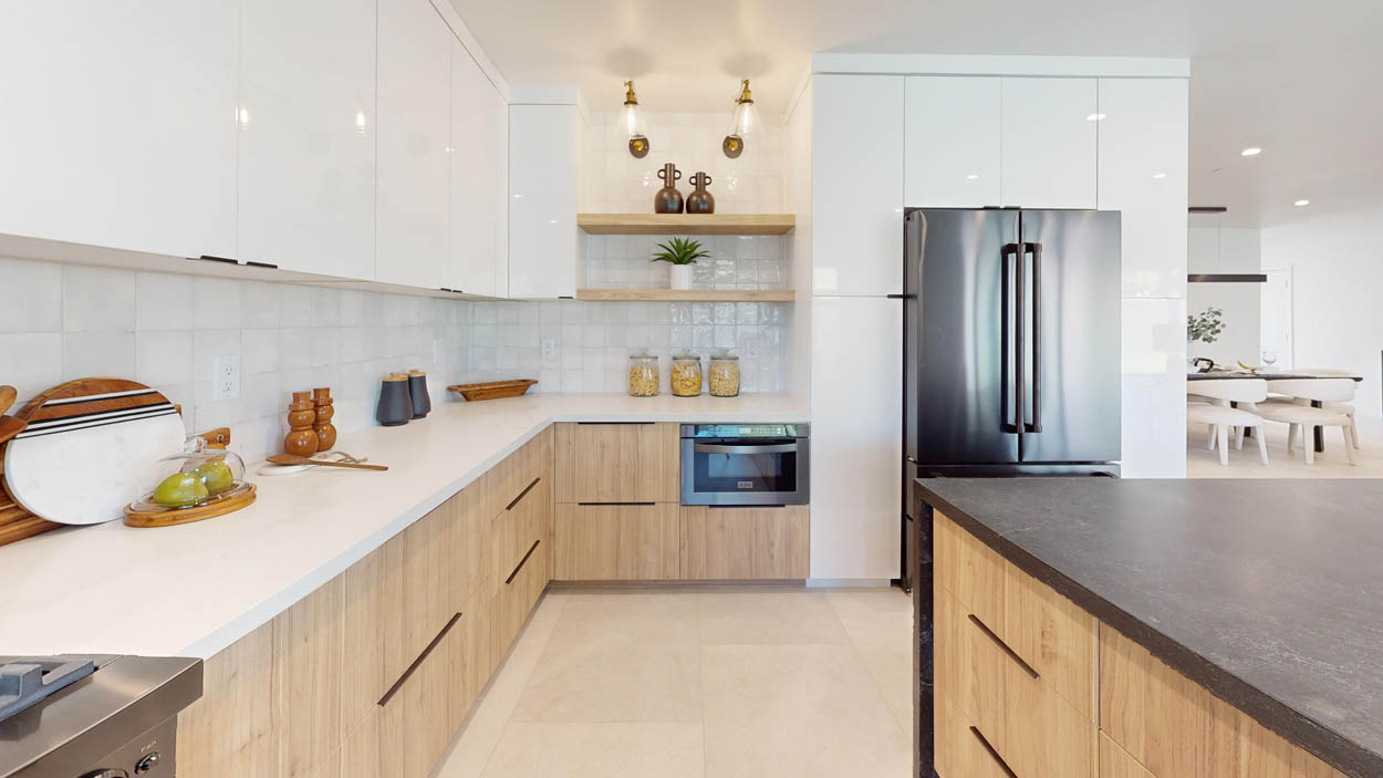 Modern Scottsdale kitchen remodel with white cabinetry, wood accents, and stainless steel appliances.